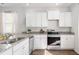Bright kitchen with stainless appliances, ample storage, and granite countertops at 6226 Gritman Dr, Hollywood, SC 29470