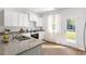 Well-lit kitchen with stainless steel appliances, and easy access to backyard at 6226 Gritman Dr, Hollywood, SC 29470