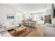 Bright, open-concept living room flowing into a kitchen with a bar, offering seamless entertaining at 6226 Gritman Dr, Hollywood, SC 29470