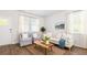 Bright, open living area with picture windows and comfortable seating at 6226 Gritman Dr, Hollywood, SC 29470
