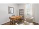 Bright office area with large window, wooden desk and shelving and wood flooring at 6226 Gritman Dr, Hollywood, SC 29470