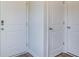 Bright hallway with white doors, modern door hardware, and wood-look flooring at 6234 Gritman Dr, Hollywood, SC 29470