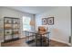 Cozy home office featuring a wood desk, shelving, comfortable chair, and natural light at 6234 Gritman Dr, Hollywood, SC 29470