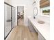 Modern bathroom with glass-enclosed shower, dual sinks, and white countertops at 641 Cottage Landing Dr, Summerville, SC 29485
