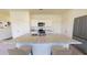 Bright kitchen with a large center island, modern appliances, and ample cabinet space at 717 Pisces Ln, Summerville, SC 29486
