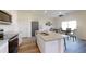Modern kitchen featuring stainless steel appliances, granite countertops, and an adjacent dining area at 717 Pisces Ln, Summerville, SC 29486