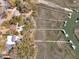 Aerial view showcasing a house with a pool and private dock with boats, nestled in a lush landscape at 741 Creekside Dr, Mount Pleasant, SC 29464