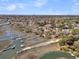 Magnificent aerial view showing houses with private docks on the water, connecting to a serene channel at 741 Creekside Dr, Mount Pleasant, SC 29464