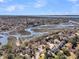 Stunning aerial view showcasing waterfront homes with private docks and serene river access in a lush setting at 741 Creekside Dr, Mount Pleasant, SC 29464