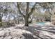 Spacious deck area with dining table overlooking the swimming pool and waterfront at 741 Creekside Dr, Mount Pleasant, SC 29464