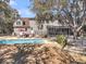 Aerial view of the backyard with pool, patio, deck, and lush landscaping, creating an inviting outdoor space at 741 Creekside Dr, Mount Pleasant, SC 29464