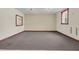 Spacious basement featuring durable carpet, painted walls, and windows with wooden trim at 741 Creekside Dr, Mount Pleasant, SC 29464