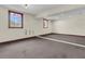 Finished basement with carpeted floors and light-painted walls, ready for customization at 741 Creekside Dr, Mount Pleasant, SC 29464