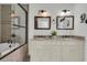 Luxurious bathroom featuring a double vanity, granite countertops, and a stylish tiled shower/tub at 741 Creekside Dr, Mount Pleasant, SC 29464