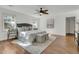 Serene bedroom with neutral decor, hardwood floors, and bright windows offering ample natural light at 741 Creekside Dr, Mount Pleasant, SC 29464