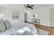 Well-lit bedroom features hardwood floors, stylish decor, and a peaceful ambiance with a ceiling fan at 741 Creekside Dr, Mount Pleasant, SC 29464