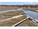 Scenic boat ramp leading to a river with docks and a charming American flag waving in the breeze at 741 Creekside Dr, Mount Pleasant, SC 29464