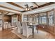 Bright dining room features wood floors, ceiling beams, and windows providing plenty of natural light at 741 Creekside Dr, Mount Pleasant, SC 29464