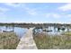 Wooden dock stretching toward the waterway at 741 Creekside Dr, Mount Pleasant, SC 29464