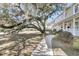Lovely home with manicured lawn and mature tree creating a picturesque setting at 741 Creekside Dr, Mount Pleasant, SC 29464