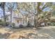 Beautiful home with a welcoming front porch, lush landscaping, and mature trees at 741 Creekside Dr, Mount Pleasant, SC 29464