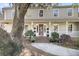 Charming two-story home with a welcoming front porch, mature landscaping, and classic architectural details at 741 Creekside Dr, Mount Pleasant, SC 29464