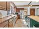 Kitchen with a farmhouse sink, wood counters, wood cabinets, and stainless steel appliances at 741 Creekside Dr, Mount Pleasant, SC 29464