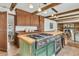 Kitchen island with gas stovetop, oven, seating, wood countertop, and stylish cabinets at 741 Creekside Dr, Mount Pleasant, SC 29464