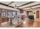Open kitchen features wood beams, countertops, and windows, with an adjacent dining area at 741 Creekside Dr, Mount Pleasant, SC 29464