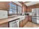 Kitchen with a farmhouse sink, wood counters, wood cabinets, and stainless steel appliances at 741 Creekside Dr, Mount Pleasant, SC 29464