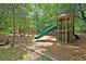 Community playground featuring a slide, swings, climbing structure, and seating area at 741 Creekside Dr, Mount Pleasant, SC 29464