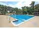 Large outdoor swimming pool with lounge chairs, umbrellas, and a lifeguard stand at 741 Creekside Dr, Mount Pleasant, SC 29464