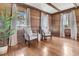 Elegant sitting room with wood paneling, natural light, hardwood floors, and comfortable armchairs, perfect for conversation at 741 Creekside Dr, Mount Pleasant, SC 29464