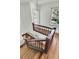 Upper view of the wooden staircase, showcasing the home's architectural details and natural light at 741 Creekside Dr, Mount Pleasant, SC 29464