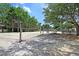 Community sand volleyball court surrounded by trees and seating, perfect for outdoor fun at 741 Creekside Dr, Mount Pleasant, SC 29464