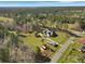Overhead shot of a home with a large lawn, outbuildings and proximity to a paved road at 760 Community Ave, Smoaks, SC 29481