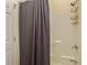 Bathroom featuring a shower with dark grey curtains and a white shower surround at 760 Community Ave, Smoaks, SC 29481