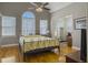 Primary bedroom with hardwood floors, high ceilings, and attached office at 760 Community Ave, Smoaks, SC 29481