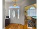 Spacious foyer featuring hardwood floors, decorative door, and access to game room at 760 Community Ave, Smoaks, SC 29481