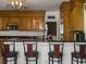 Eat-in kitchen featuring stainless steel appliances, granite countertops, breakfast bar, and pendant lighting at 760 Community Ave, Smoaks, SC 29481