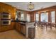 Open kitchen featuring granite countertops, stainless steel appliances, breakfast bar, and a cozy breakfast nook with a chandelier at 760 Community Ave, Smoaks, SC 29481