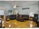 Cozy living room with hardwood floors, vaulted ceiling, and comfortable leather seating at 760 Community Ave, Smoaks, SC 29481