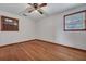 Bedroom featuring hardwood floors and two windows at 7659 Allwood Ave, North Charleston, SC 29418