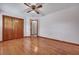 Bedroom with hardwood flooring and a spacious closet at 7659 Allwood Ave, North Charleston, SC 29418