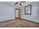Bedroom featuring neutral walls, carpet and a window with blinds with an open door at 7659 Allwood Ave, North Charleston, SC 29418