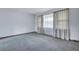 This empty bedroom offers large windows and neutral walls and carpets, for customization and comfort at 7659 Allwood Ave, North Charleston, SC 29418