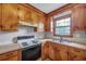 Eat-in kitchen with double sink and lots of wood cabinets at 7659 Allwood Ave, North Charleston, SC 29418