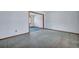 Empty living room with neutral walls and carpets, offering a blank canvas for new homeowners at 7659 Allwood Ave, North Charleston, SC 29418