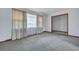 Empty living room featuring a window, neutral walls and carpets, offering a blank canvas at 7659 Allwood Ave, North Charleston, SC 29418