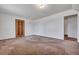Room with carpet, wood door and entry to hallway at 7659 Allwood Ave, North Charleston, SC 29418